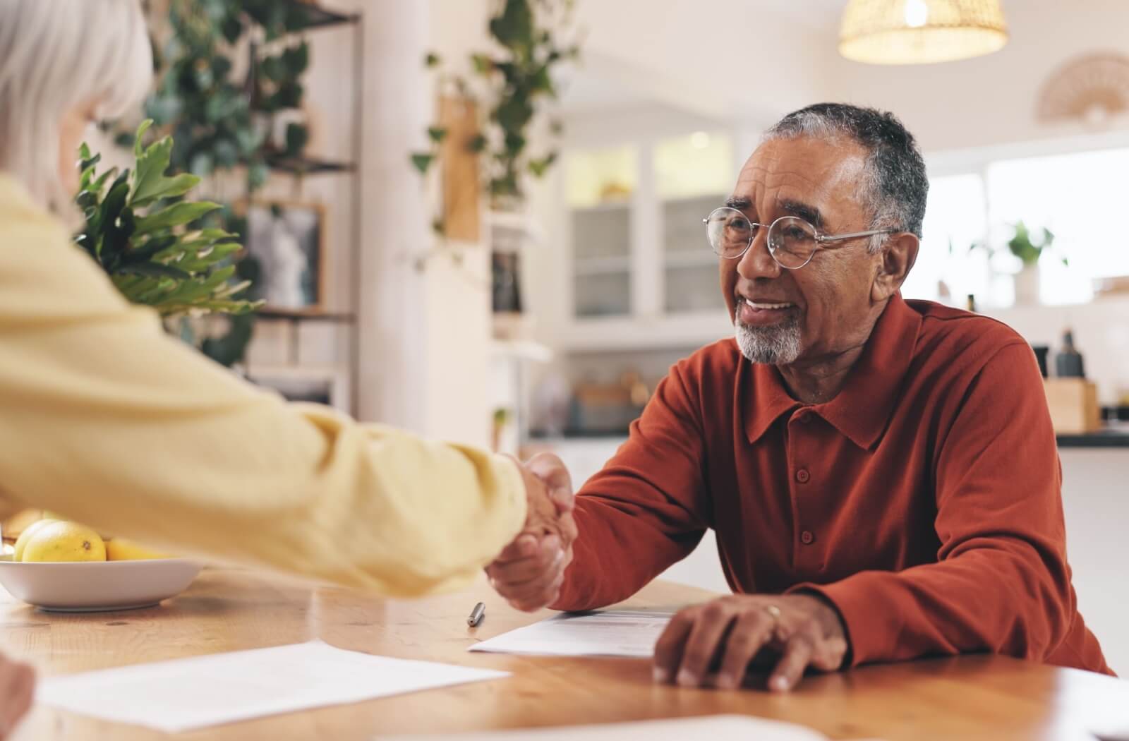 Someone shakes hands after finding the assisted living community for them.
